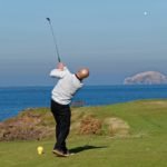 Golfer Tees off in Scotland